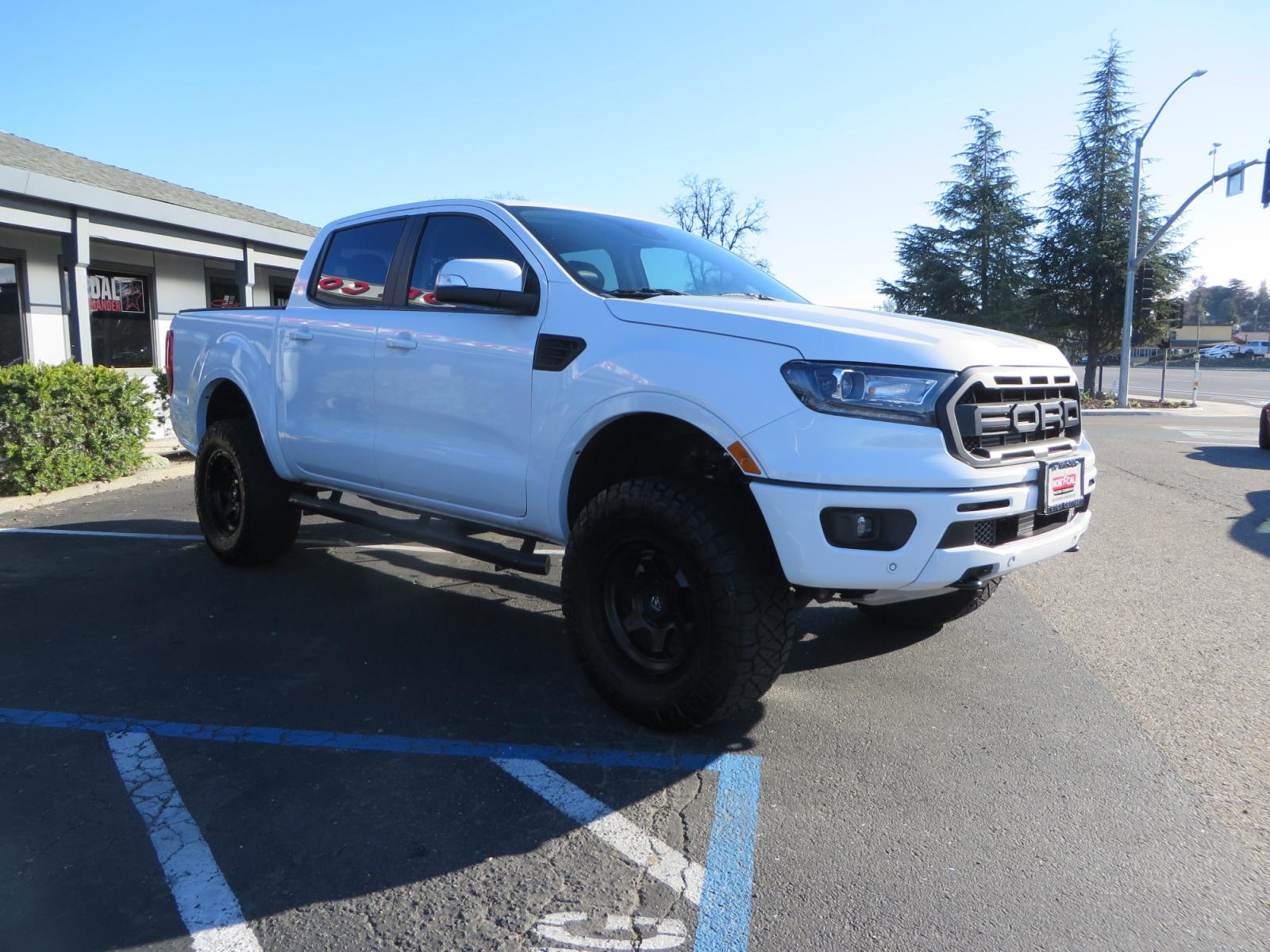 2019 White /Black Ford Ranger Lariat (1FTER4FHXKL) with an 2.3L engine, automatic transmission, located at 2630 Grass Valley Highway, Auburn, CA, 95603, (530) 508-5100, 38.937893, -121.095482 - Features a Fabtech suspension system, Fuel Offroad wheels, Nitto Ridge Grappler tires, Westin Running boards, and a Bakflip. - Photo #2